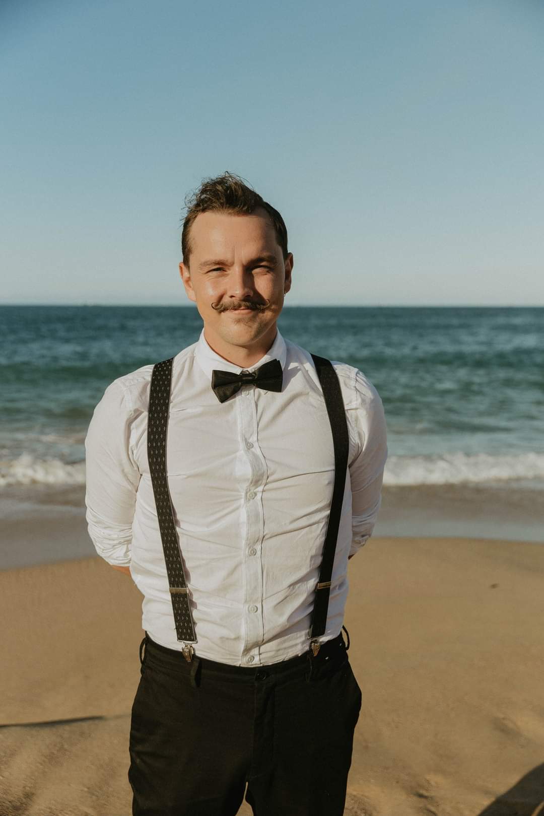 Picture of Rowan on the beach in a suit